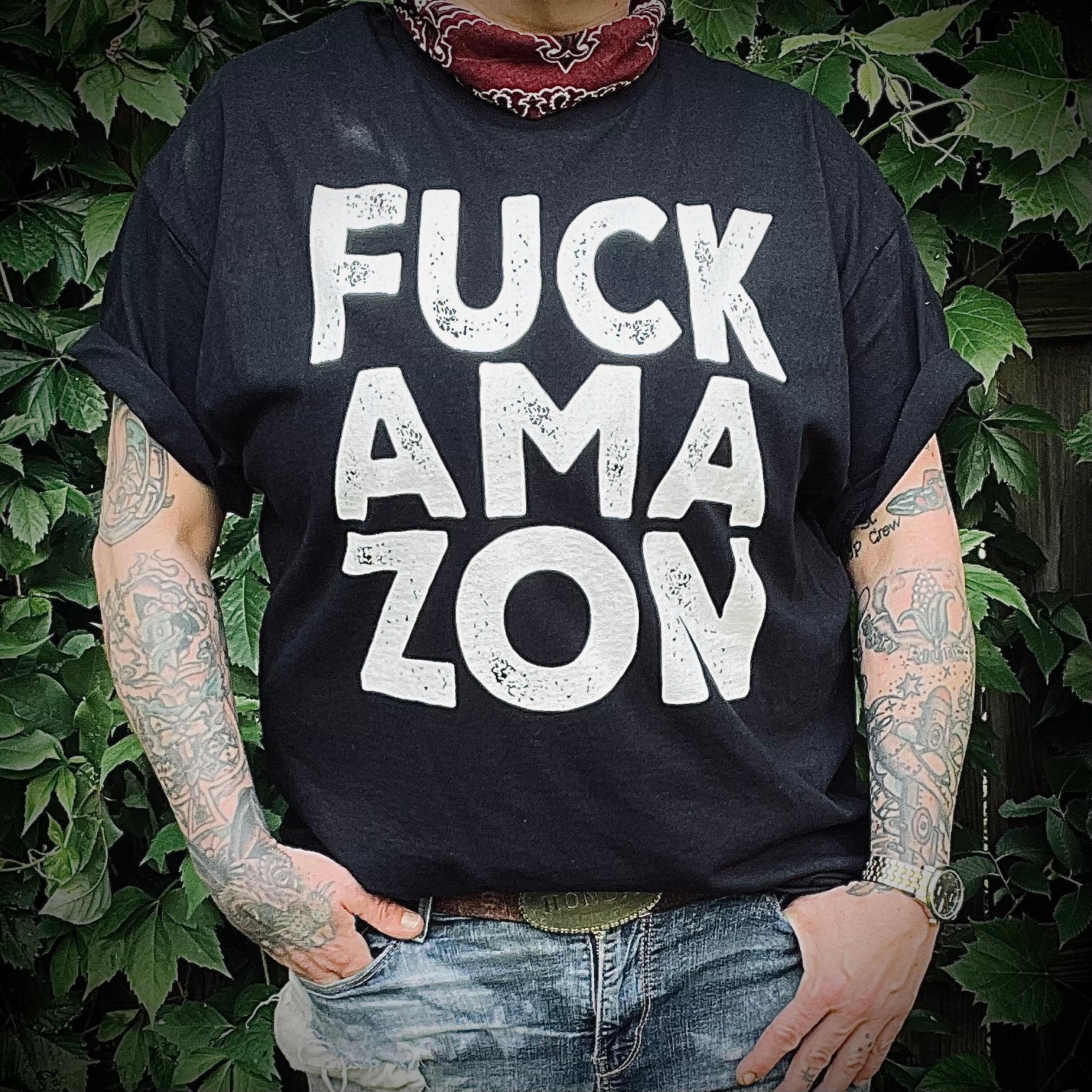 Model wearing t-shirt that reads Fuck Ama-Zon in bold white lettering.