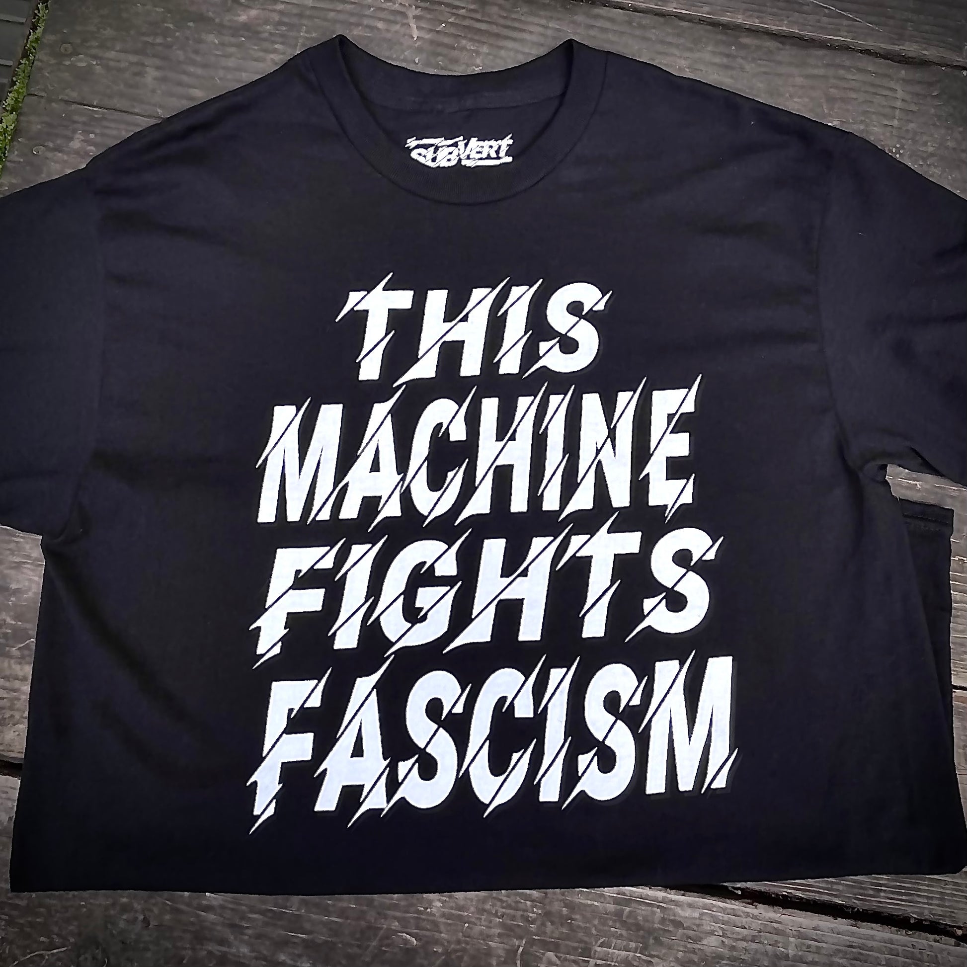 Black t-shirt that reads This Machine Fights Facism in bold white lettering